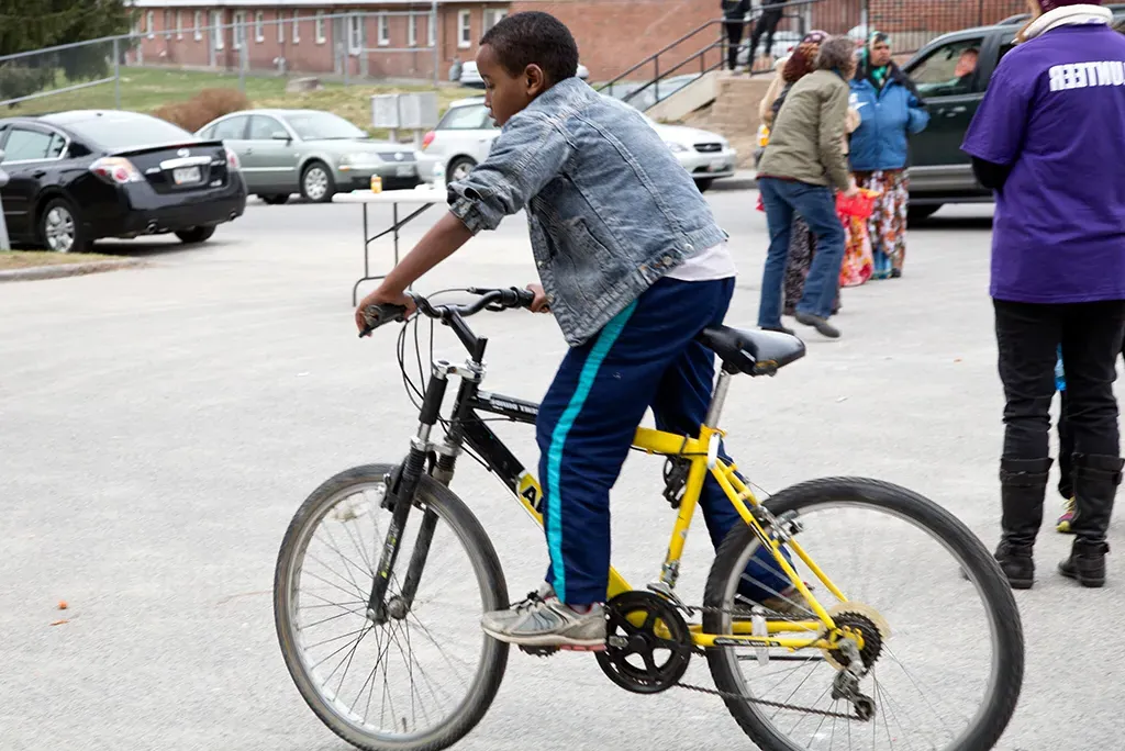 A kid riding a bicycle