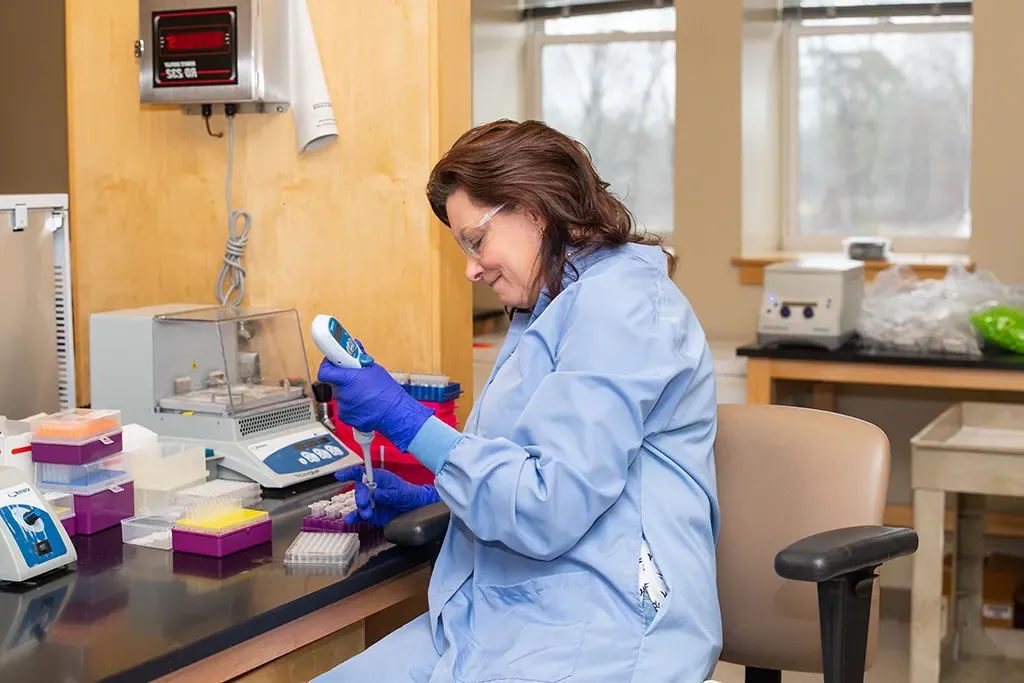 A professor working in a lab setting