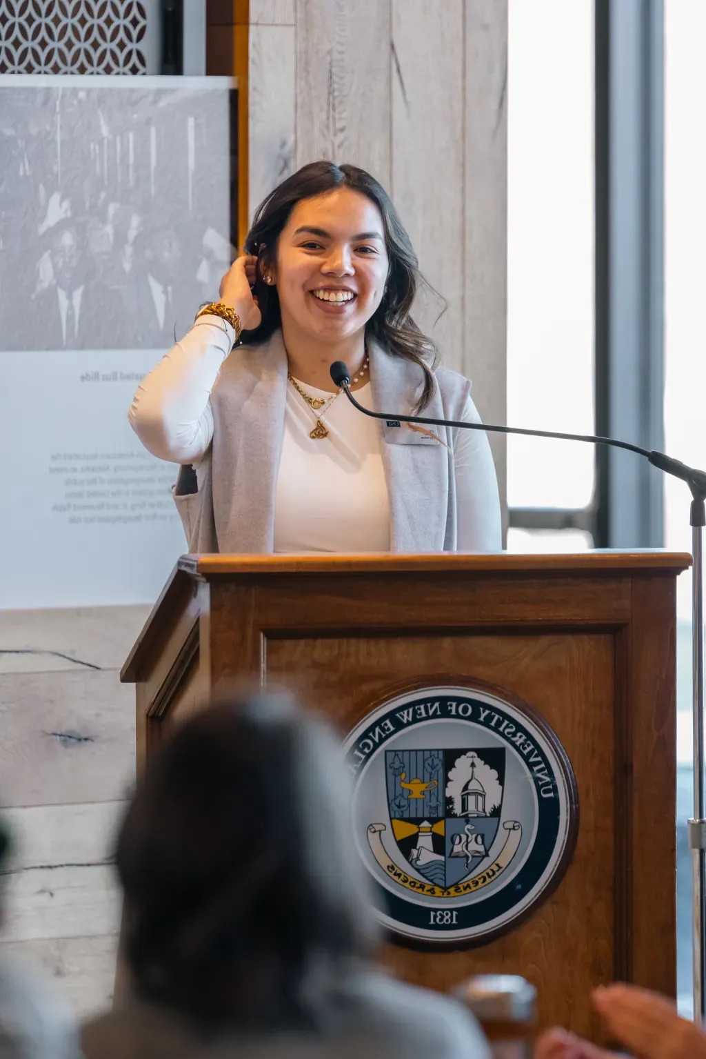 Student speaker Olivia Lu-Alba speaks at the podium