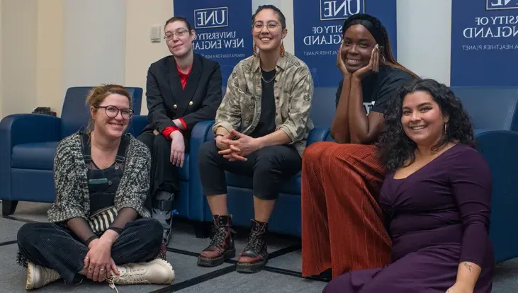 A group of students sit together at an M L K Day event