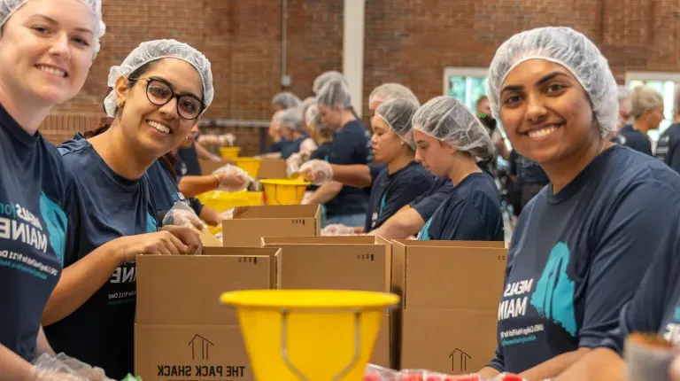 Students pose for a photo at the 2024 Meals for Maine event