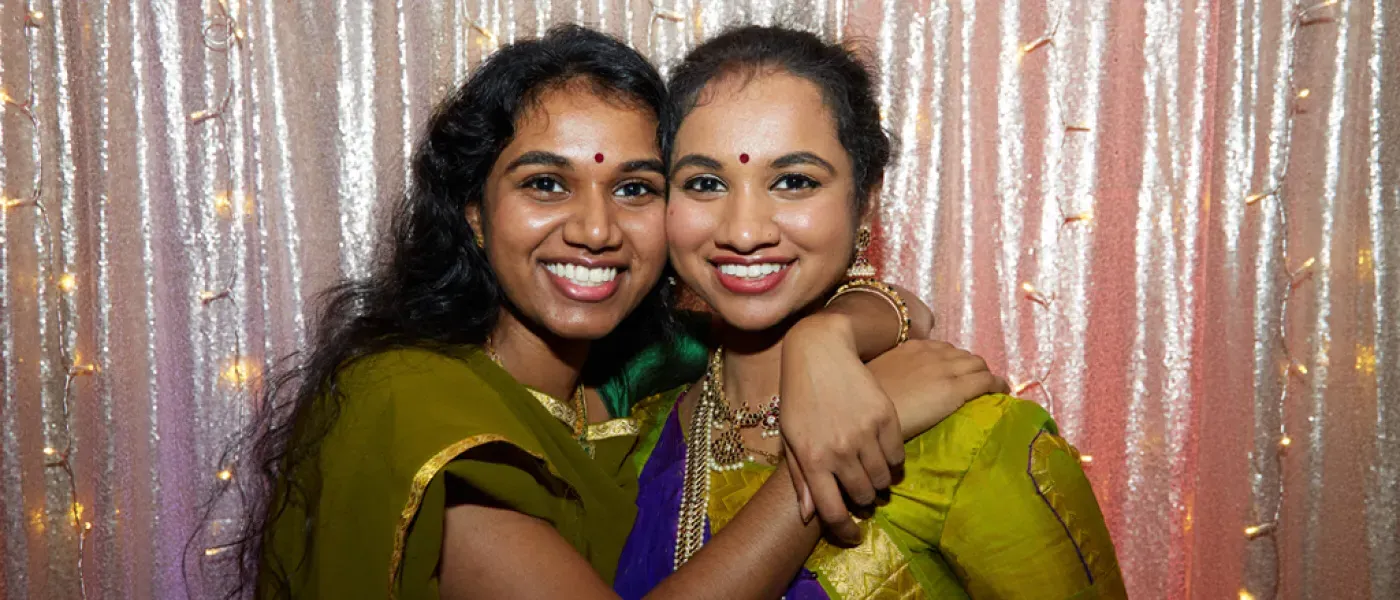 Two College of Osteopathic Medicine students embracing at the Diversity Gala