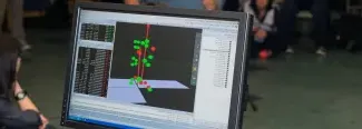 a computer screen shows a three D model used in motion analysis